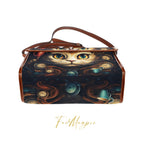 Handbag with a cat design and tea cup illustrations on a white background, featuring the brand 'Fae & Magpie'.