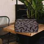 Fae & Magpie spooky satchel bag featuring a dark, gothic design with a black leather finish and decorative spooky elements.