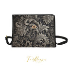 Decorative bag with intricate floral patterns on a white background, featuring the brand 'Fae & Magpie'.