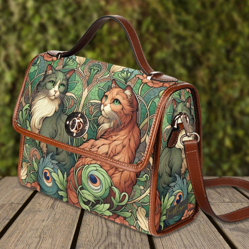 Fae & Magpie Cats Green Satchel Handbag with adjustable strap and top handle, featuring a stylish feline design.