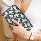 White Fae & Magpie cats satchel handbag with a structured design, featuring a top handle and subtle cat motifs.