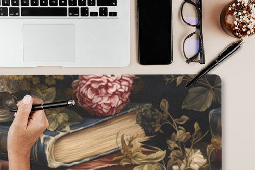 Fae & Magpie Books Mouse Pad with colorful book-themed design, smooth surface ideal for computer mouse use.