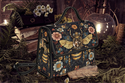 Fae & Magpie Bee Satchel Handbag featuring a woven bee design, brown leather accents, and a sturdy top handle.