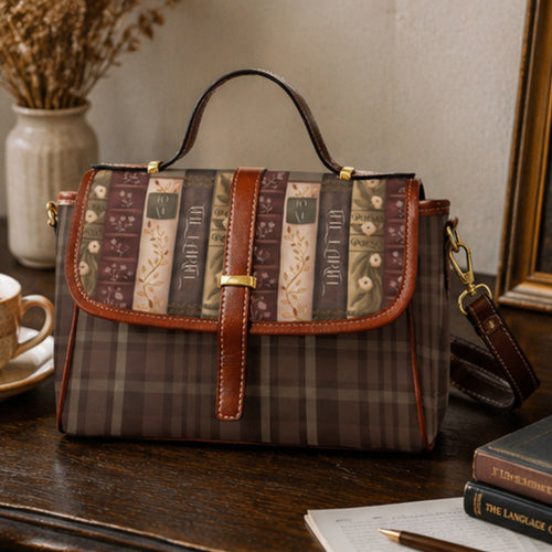 Brown plaid handbag with patterned flap on a wooden surface