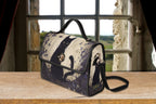 Fae & Magpie black cat satchel bag with structured design and top handle, featuring a sleek, elegant look for stylish accessories.