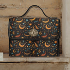 Handbag with celestial pattern on a wooden surface