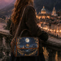 Person with a decorative bag featuring a night sky design, standing on a balcony overlooking a cityscape at dusk.