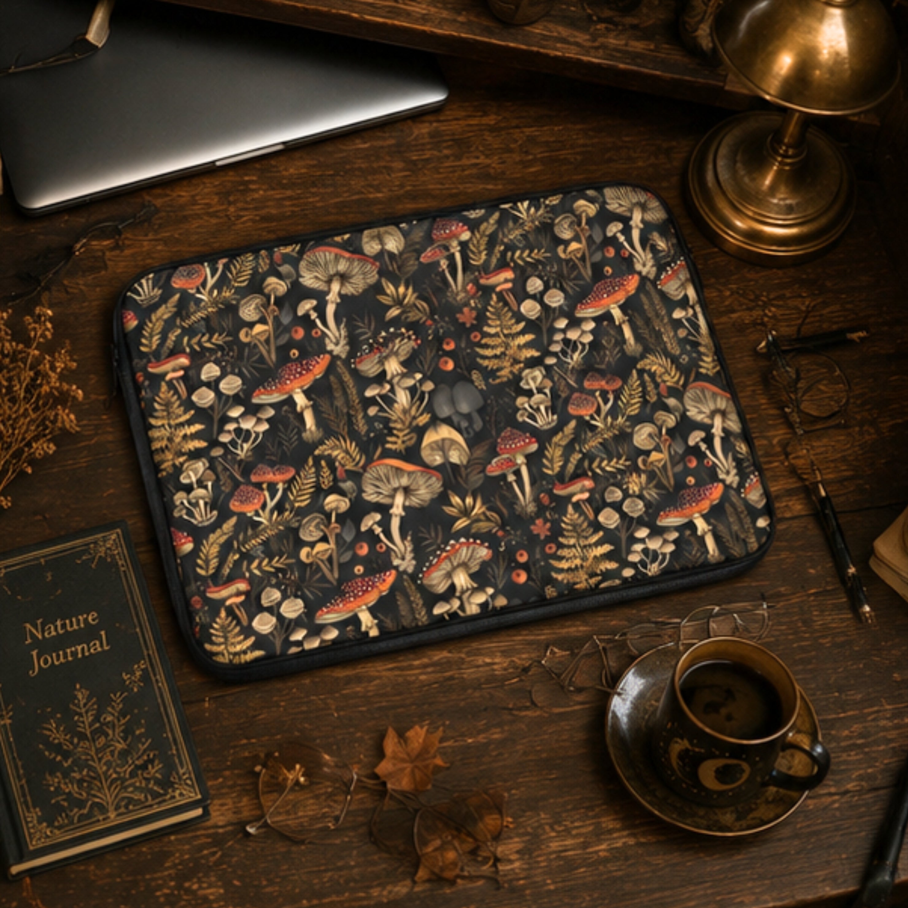 Felt mat with mushroom pattern on a wooden surface with a laptop, book, and cup.