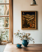 A framed fantasy art print depicting a witch with a broom in a forest of glowing mushrooms under a starry night sky, hanging on a white wall in a cozy room setting with a wooden table, blue teapot, and flowers.