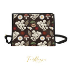 Handbag with mushroom and flower pattern on a brown background, featuring the brand 'Fae & Magpie'.