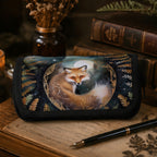 Felt pouch with fox design on a table with books and a pen