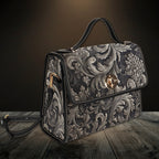 Decorative handbag with intricate patterns on a wooden surface