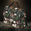 Floral and mushroom patterned handbag on a wooden surface with a dark background