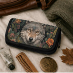 Wallet with wolf design surrounded by personal care items on a textured surface
