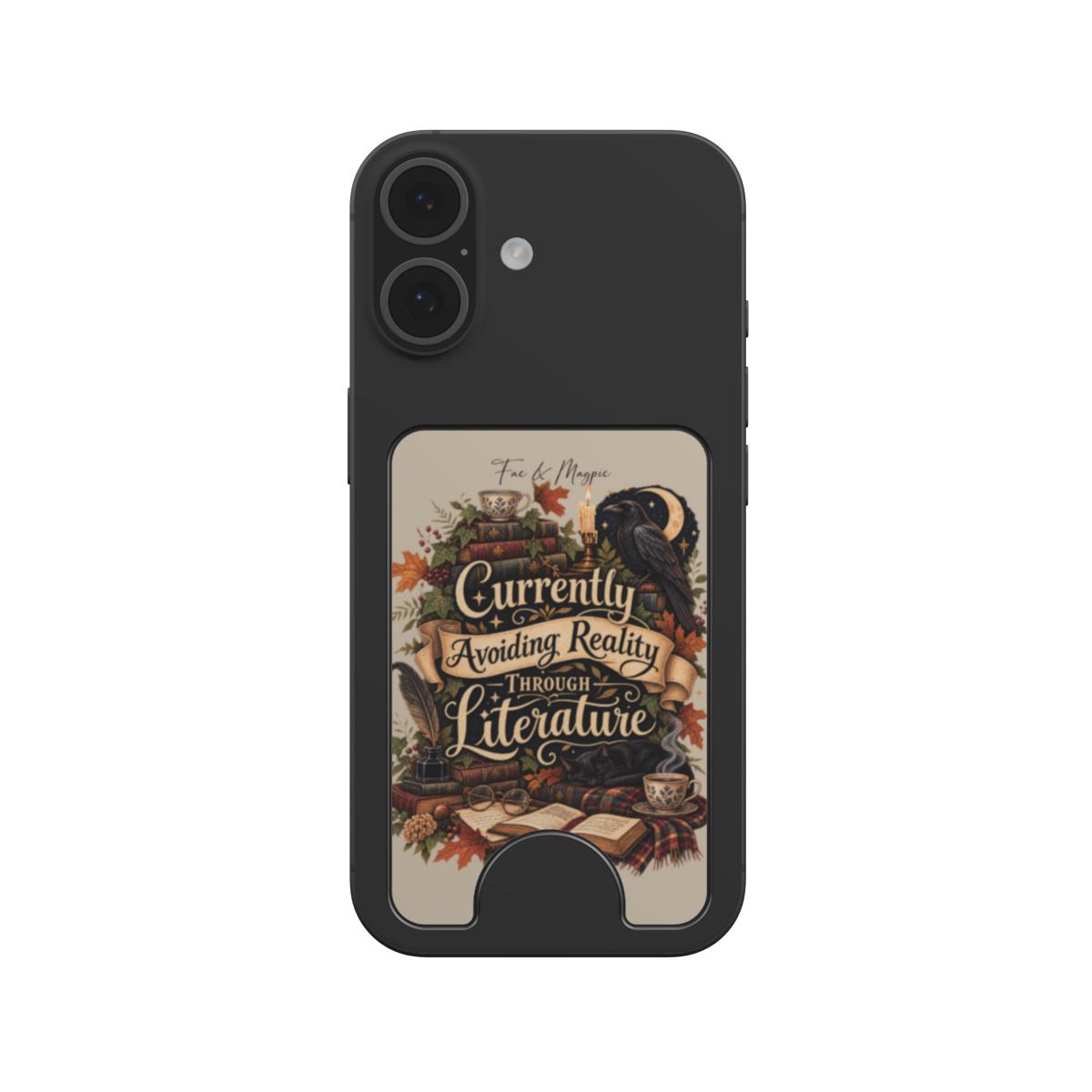 A black protective phone case with a built-in card slot, featuring a vintage-style illustration of a raven, books, and autumn leaves with the text 'Currently Avoiding Reality Through Literature' on a cream background.