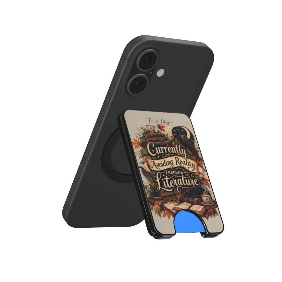 A black phone case with an integrated kickstand, shown from two angles. The back view shows a matte black finish with a circular MagSafe ring.