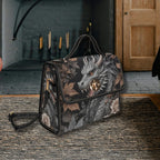 Handbag with dragon design on a textured surface