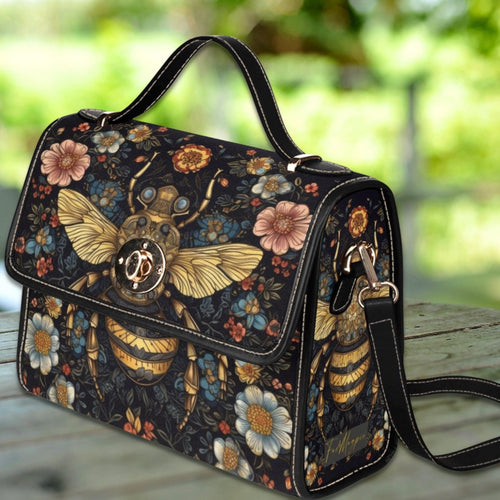 Fae & Magpie Bee Satchel Bag, stylish handbag with bee motif, featuring a structured design and leather accents.