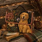 A structured tote bag with a floral tapestry-style background and a golden retriever printed across the front, styled on a rustic wooden bench with books, a coffee cup, and dried flowers.
