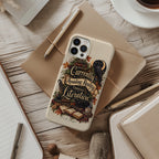 A phone case with a vintage-style bookish illustration and the phrase 'Currently Avoiding Reality Through Literature' is shown in a styled flat-lay on a wooden desk with notebooks, a pen, and a cup of coffee.