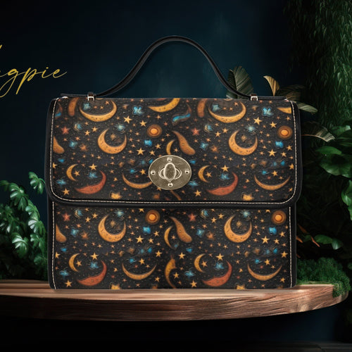 Handbag with celestial pattern on a dark background, featuring the brand 'Fae & Magpie'.