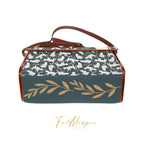 White cats satchel handbag by Fae & Magpie featuring a charming cat design with a white leather finish and adjustable strap.