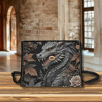 Clutch bag with dragon design on a wooden surface