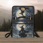 Handbag with witch design against a moonlit sky on a wooden surface