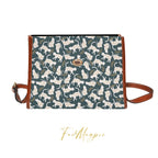 White cats satchel handbag by Fae & Magpie, featuring a stylish design with a white feline motif and a structured silhouette.
