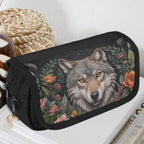 Black pencil case with a wolf design and floral patterns on a white surface.