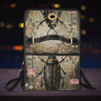 Handbag with beetle and floral design on a dark background