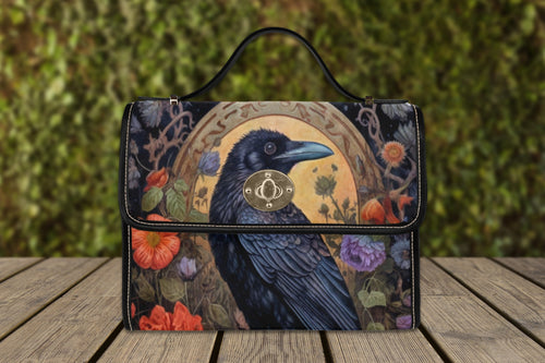Black Crow Satchel Handbag by Fae & Magpie with sturdy top handles and brass hardware on textured black leather.