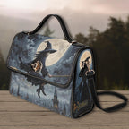Handbag with witch and moon design on a wooden surface