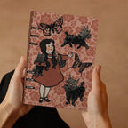 Girl and dog planner by Fae & Magpie with colorful floral cover and writable pages, designed for organizing and planning.