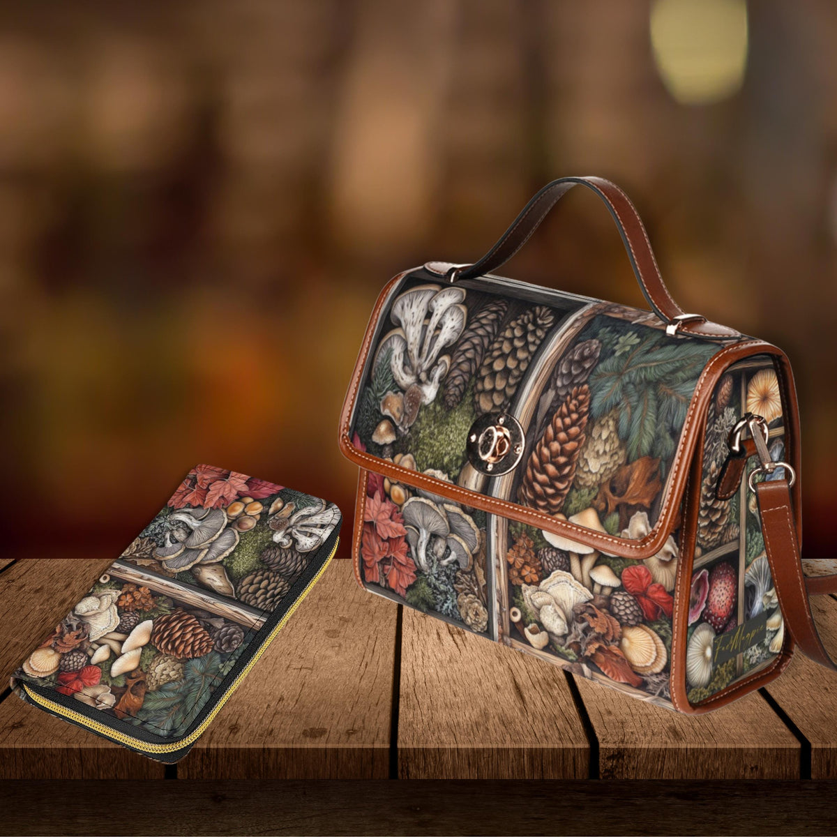 Handbag and wallet with nature-themed design on a wooden surface