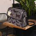 Fae & Magpie Spooky Satchel Bag with spooky design, black leather, and adjustable strap, perfect for Halloween-themed fashion.