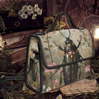 Handbag with beetle design on a dark background with books and plants
